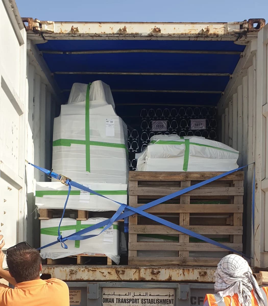 Engineer performing quality inspection with checklist and parts